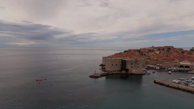 Dubrovnik old port aerial with the harbor breakwater and boats