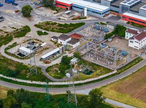 Aerial view of the Roquette plant producing starch and glucose syrups with industrial buildings and an electrical substation in Serravalle Scrivia, Piedmont, Italy.