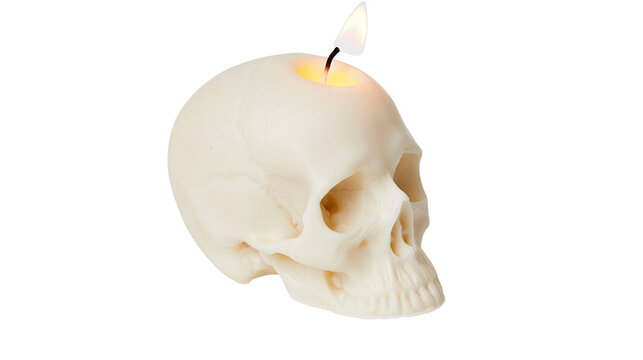 Creamy white skull shaped candle with burning flame, isolated on transparent background