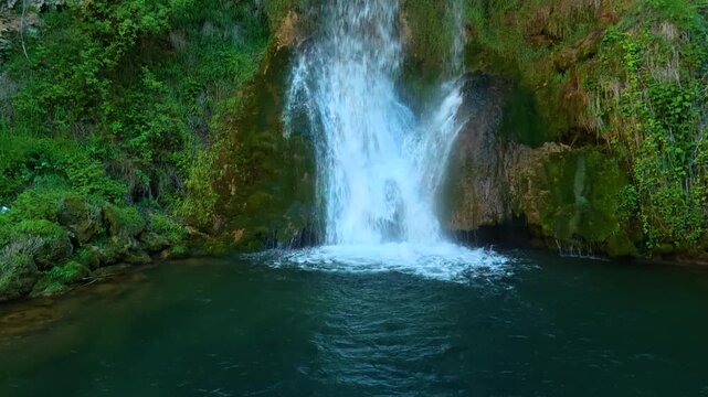 Waterfalls cascade into deep green pools. Veliki Buk, Serbia.