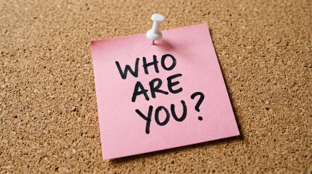 Who are you written on a pink sticky note pinned to a cork board