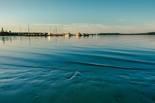 View of the calm waters and moored boats at the marina in Emu Point, Western Australia, Australia.