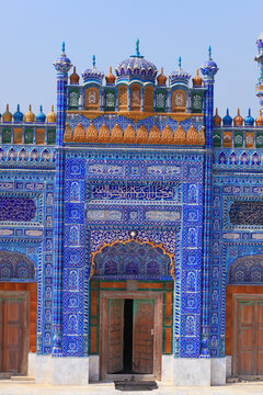View of the ornate blue tile work and traditional Islamic architecture of the Kamaro Sharif Mosque in Kaamaro Sharif, Sindh, Pakistan.