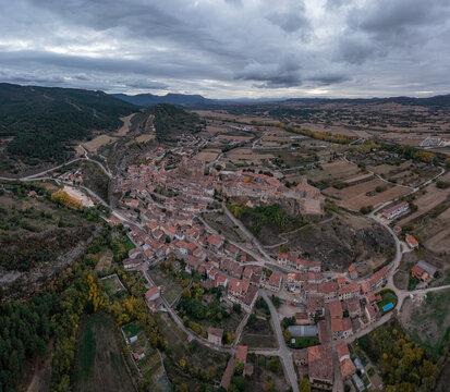 Aerial view of the historic town of Frias, featuring its medieval castle, stone buildings, and surrounding rural landscape in Frias, Castilla y Leon, Spain.