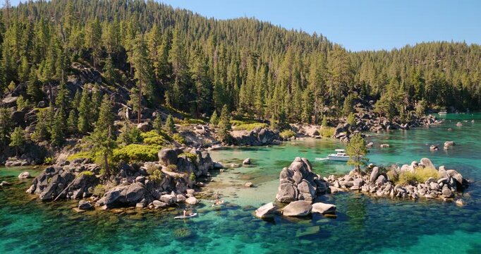 Lake Tahoe - Paddle Bordering Paddling Though Rock Formation in Shallow Clear Waters on East Shore