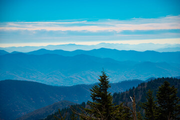 Naklejka premium The Great Smoky Mountains at sunrise. The famous blue haze hangs over the entire mountain range thus Blue Ridge Mountains.
