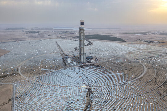 Aerial view of the Ashalim Power Station, a concentrated solar power plant with a central tower surrounded by a vast field of heliostats in the Negev, Beersheba, South District, Israel.