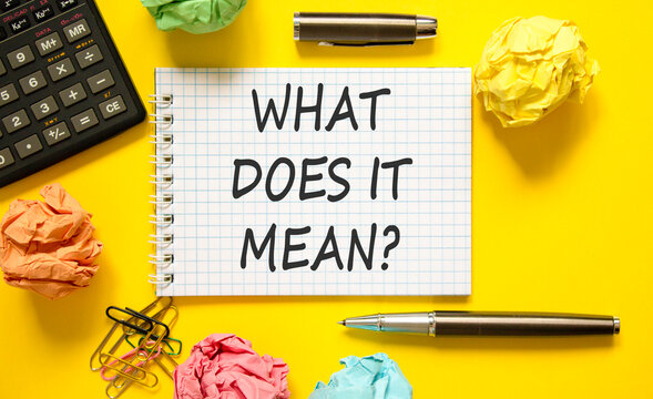 What does it mean symbol. Concept words What does it mean on beautiful white note. Beautiful yellow background. Black calculator. Business What does it mean motivational support concept. Copy space.