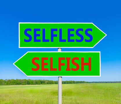 Selfless instead selfish words symbol. Concept words Selfless Selfish on beautiful green road sign. Beautiful blue sky background. Business medical psychology selfless selfish concept. Copy space.