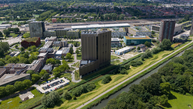 Aerial view of the Digital Realty Amsterdam AMS17 data center surrounded by green spaces, a canal, and modern office buildings in Amsterdam, Noord-Holland, Netherlands.