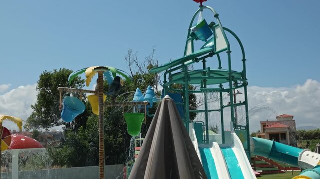 Close up view of colorful water splashes in slow motion at children's water park. Crete. Greece.