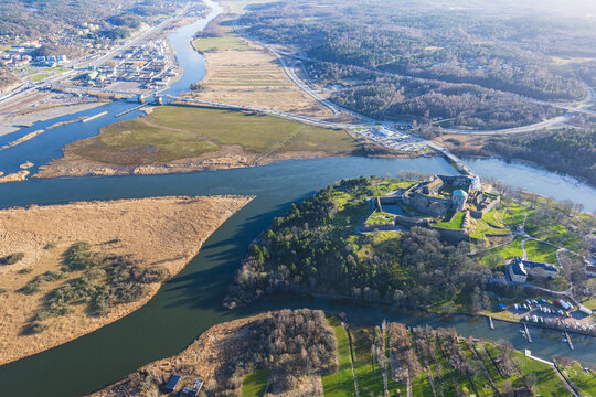 Aerial view of Bohus Fortress situated on a rocky outcrop surrounded by the river and wetlands in Kungalv, Vastra Gotalands lan, Sweden.