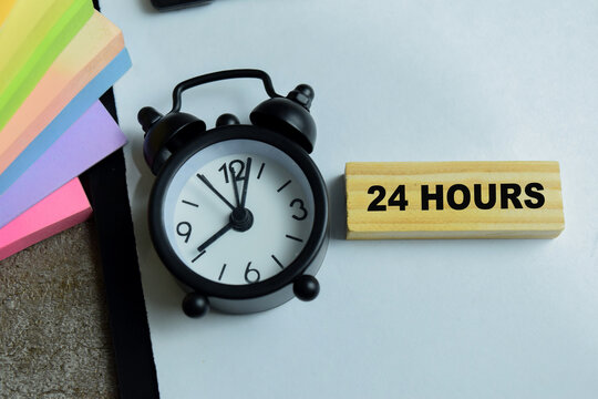Concept of 24 hours text on wooden blocks. For time management and deadline