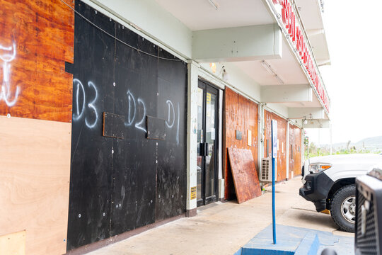 San Jose, Tinian, Northern Mariana Islands - 05 July 2026: View of boarded-up storefronts and businesses in San Jose, prepared for an approaching storm.