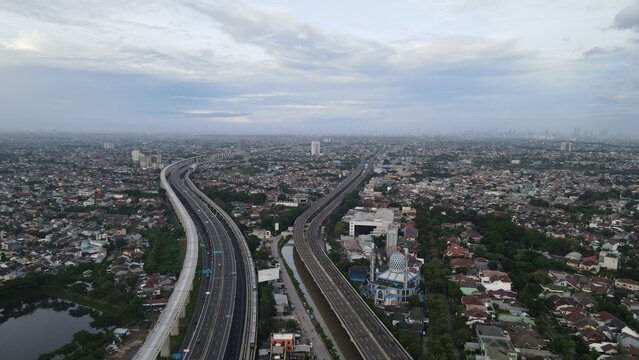 Aerial view of the elevated highway and urban landscape in Bekasi Barat, West Java, Indonesia.