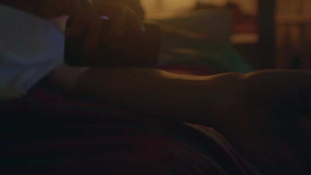 Calm evening with tender touch, Peaceful scene of caring in quiet night, Serene moment showing delicate care near lamp, Tranquil nighttime image capturing gentle gesture by bedside lamp