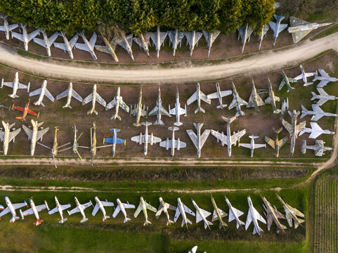 Aerial view of the extensive collection of vintage fighter jets and military aircraft parked in rows at the Chateau de Savigny-les-Beaune, Savigny-les-Beaune, Bourgogne-Franche-Comte, France.