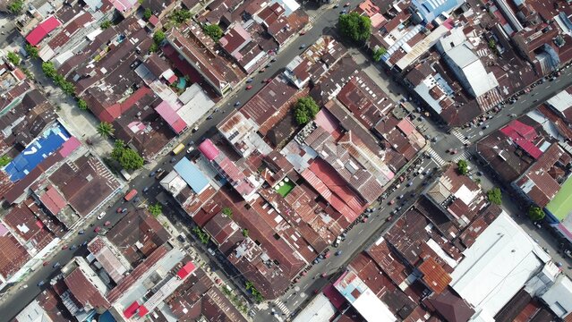 Aerial view of the dense urban layout of Iquitos, featuring a grid of streets, diverse rooftops, and scattered greenery, Iquitos, Loreto, Peru.