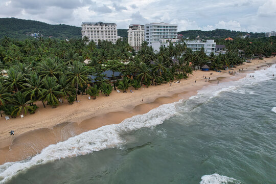 Aerial view of Long Beach with palm trees, sandy shore, and coastal resorts in Phu Quoc, Kien Giang, Vietnam.