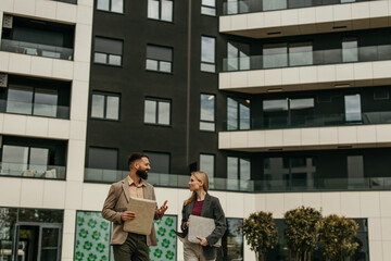Fototapeta premium Business colleagues talking outside modern office building
