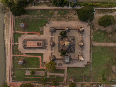 Aerial view of Wat Chaiwatthanaram, an ancient Buddhist temple complex with a central prang, surrounding chedis, and stone courtyards, in Tambon Ban Pom, Phra Nakhon Si Ayutthaya, Thailand.