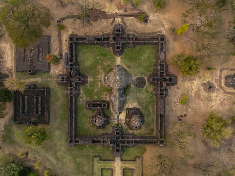 Aerial view of Phimai Historical Park featuring ancient Khmer temple ruins surrounded by green lawns and trees in Nai Mueang, Nakhon Ratchasima, Thailand.