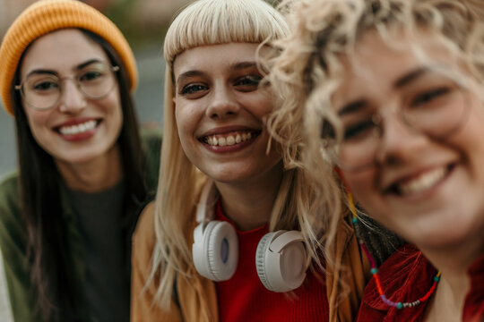 Group of diverse women friends smiling together outdoors