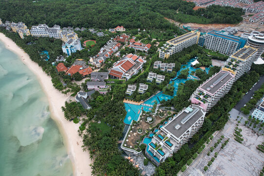 Phu Quoc, Kien Giang, Vietnam - 12 June 2022: Aerial view of JW Marriott Emerald Bay Resort and Premier Residences at Khem Beach with luxury buildings, pools, gardens, and sandy coastline.