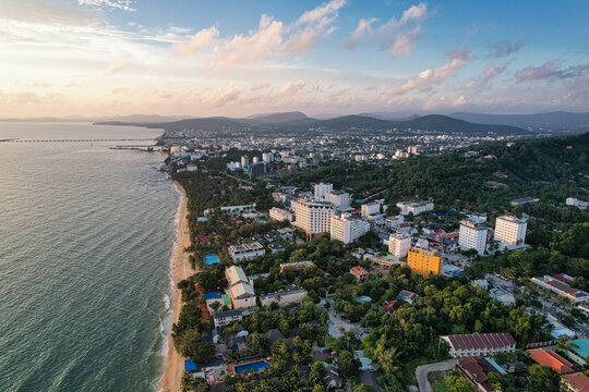 Aerial view of Duong Dong town and Long Beach at sunset with hotels, lush greenery, and the coastline of Phu Quoc, Kien Giang, Vietnam.