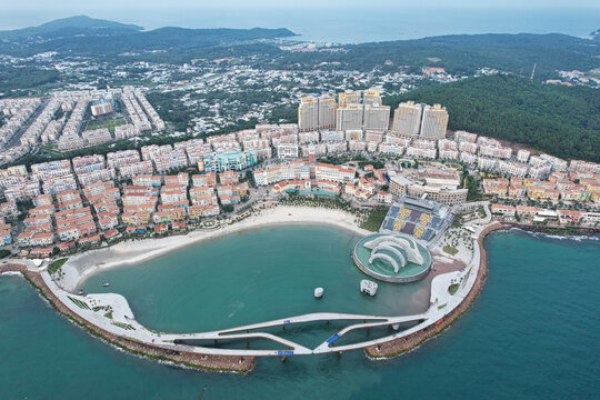 Phu Quoc, Kien Giang, Vietnam - 14 June 2023: Aerial view of Sunset Town featuring Mediterranean-style architecture, the Kiss Bridge, and the coastline on Phu Quoc island.