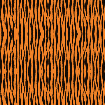 Bold orange tiger stripe seamless pattern with black organic lines. Ideal for fabric, wallpaper, wrapping paper, apparel, packaging, backgrounds, and textile designs.