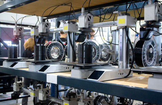 3D printer. Many 3D printers printing object close-up. 3D printer printing black