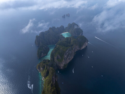 Aerial view of Pi Leh Bay with turquoise water, limestone cliffs, and boats in the Andaman Sea, Tambon Ao Nang, Chang Wat Krabi, Thailand.