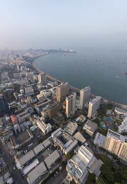 Aerial view of high-rise hotels and urban architecture along the coastline of Pattaya City, Chon Buri, Thailand.