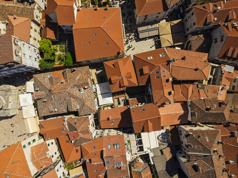 Aerial view of the historic town of Kotor with its dense terracotta rooftops, narrow stone streets, and medieval architecture in Kotor, Kotor Municipality, Montenegro.