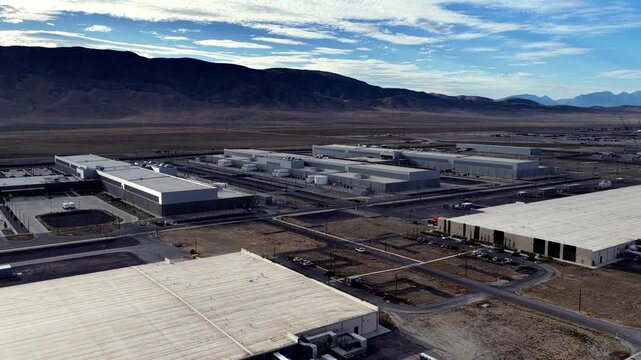 Aerial view of the Eagle Mountain hyperscale Meta Data Center complex with large industrial buildings, paved roads, and desert landscape in Eagle Mountain, Utah, United States.