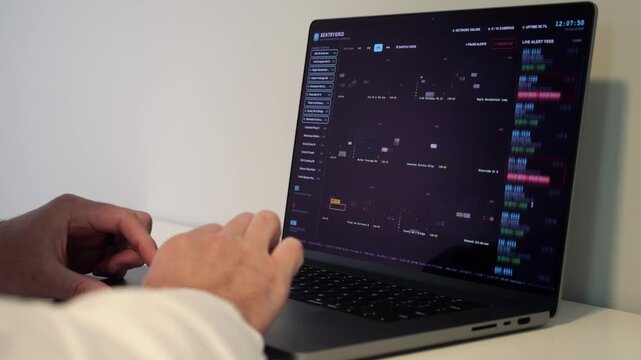 Investigator Detective on laptop using automated license plate reader software to track vehicle locations, illustrating law enforcement surveillance