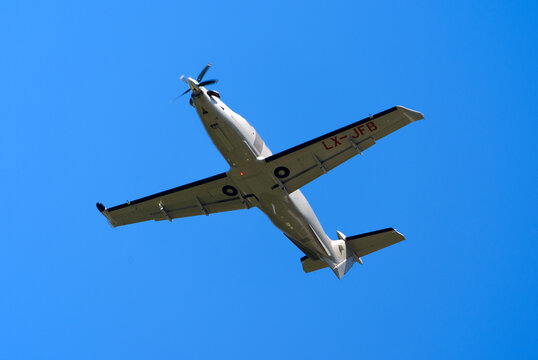 Private airplane type Pilatus PC-12 NG registration LX-JFB taking off from Swiss Z&uuml;rich Airpot on a sunny summer day. Photo taken August 4th, 2026, R&uuml;mlang, Switzerland.