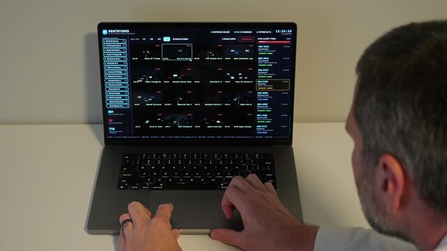 Investigator Detective on laptop using automated license plate reader software to track vehicle locations, illustrating law enforcement surveillance