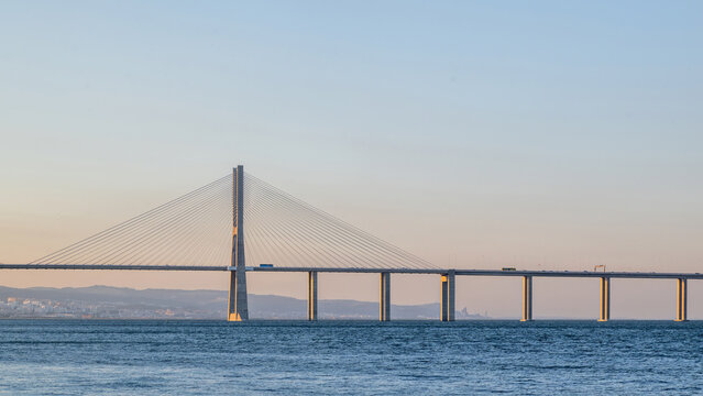 Lisboa, Portugal - 07 July 2026: View of the Vasco da Gama Bridge spanning the Tagus River under a clear sky.