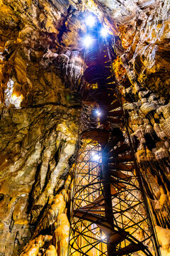 Moaning Caverns stairway glows amid illuminated formations