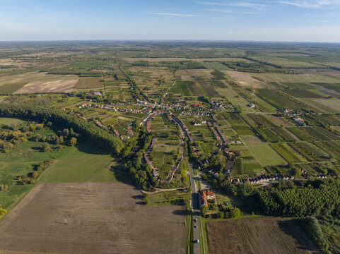 Aerial view of Hajos pincefalu, a historic wine cellar village with rows of traditional cellars surrounded by agricultural fields and vineyards in Hajos, Hungary.