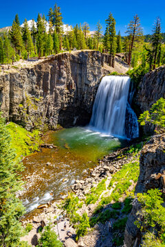 Rainbow Falls dropping over volcanic cliff into pool at Devils Postpile National Monument California