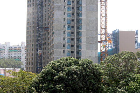 Construction scaffolding netting and webbing  tall building apartments in Asian country