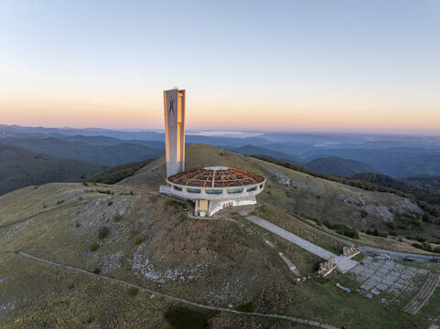 Aerial view of the Buzludzha Monument, a striking brutalist structure perched on a mountain peak in Stara Zagora, Bulgaria.