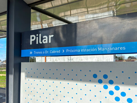 Official platform signage with route information at Pilar station - Argentina