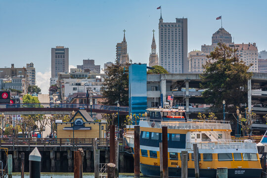 San Francisco waterfront view with ferry boat and Saints Peter and Paul Church spires