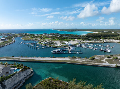 Aerial view of a marina filled with yachts in the turquoise waters of Exuma, Bahamas.