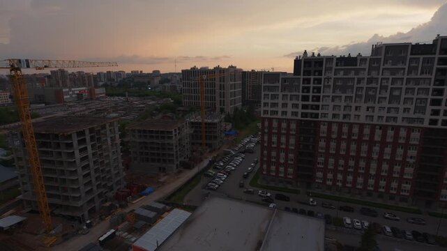 Storm arrives in a city. Timelapse of the urban area during evening time with stormy clouds with rain starting to form over the city