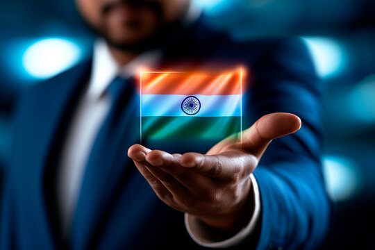 Businessman holding glowing digital India flag hologram over extended hand